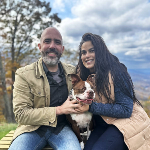 The Spire Forge founders with Leo, the chief morale officer, overlooking the Blue Ridge Mountains.
