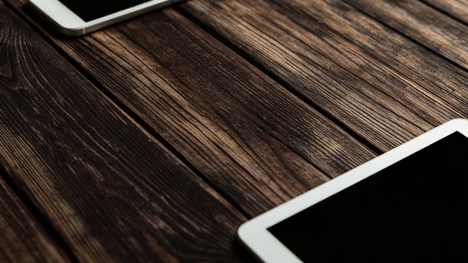 Table displaying tablets, Spire Forge web design results, representing client success and digital craftsmanship.